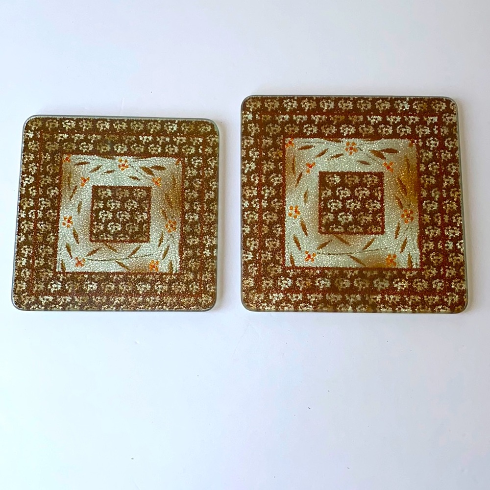 Temptations trivet set of two